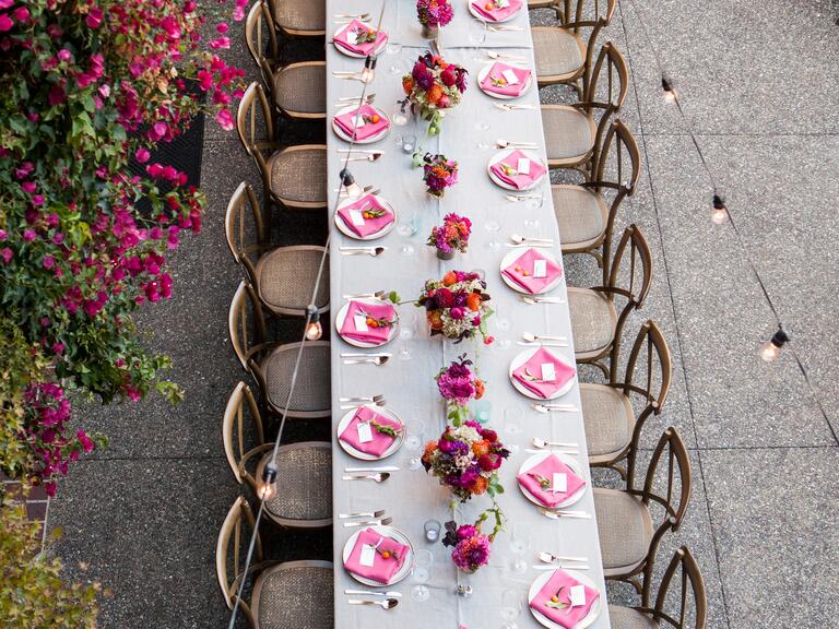 An aerial view of a reception with pink accents