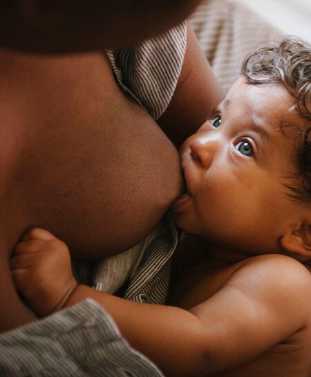 Breast and store bottle feeding baby