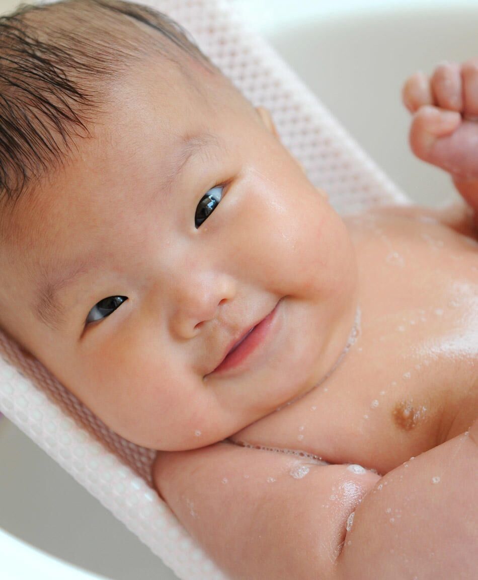 bathing baby in big bath