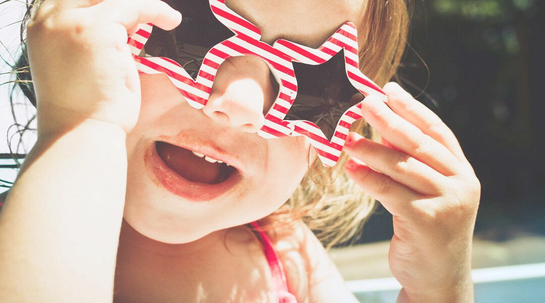 baby celebrate fourth of july with festive sunglasses