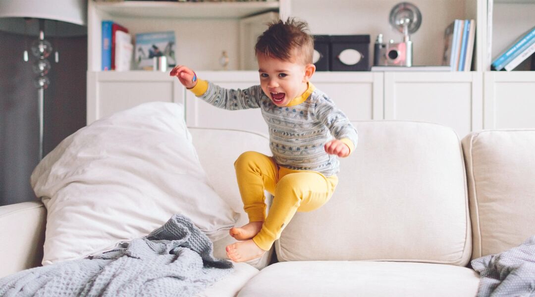 little energetic boy jumping home