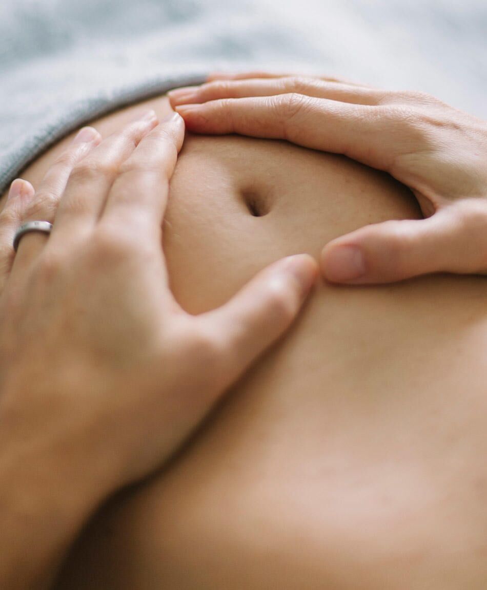 Side View Of Pregnant Belly With Peircing Stock Photo - Download