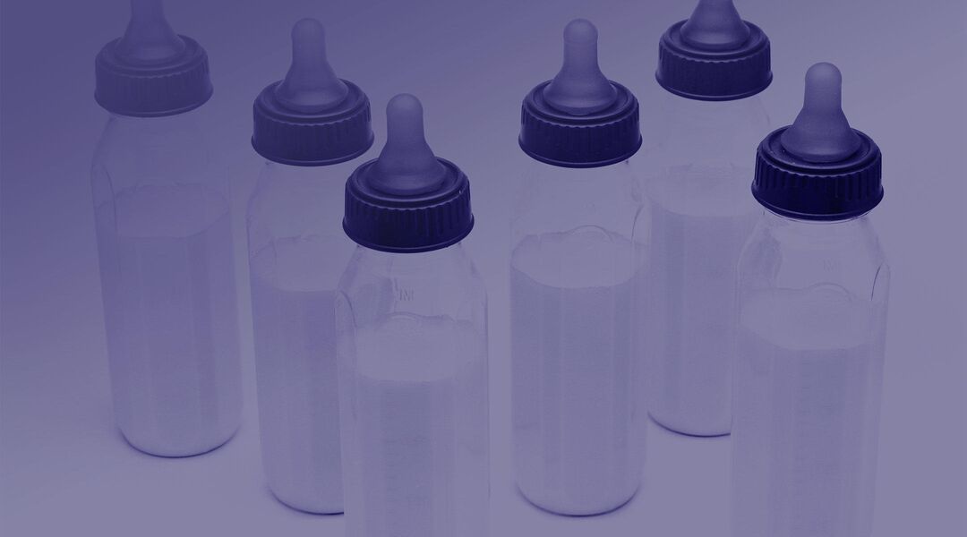 baby bottles arranged with purple gradient
