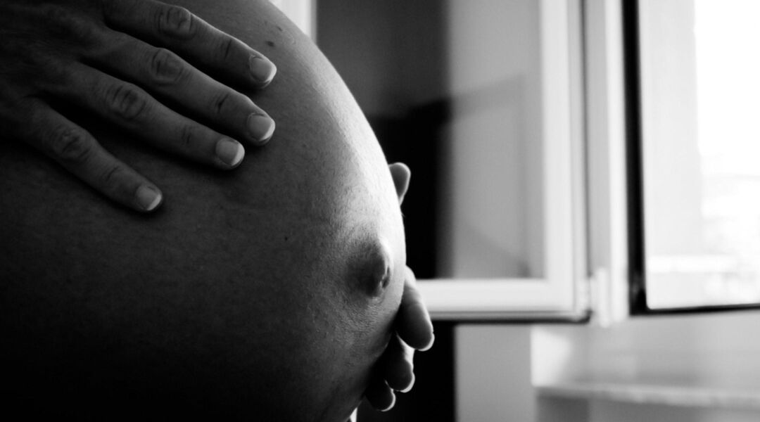 closeup big pregnant belly