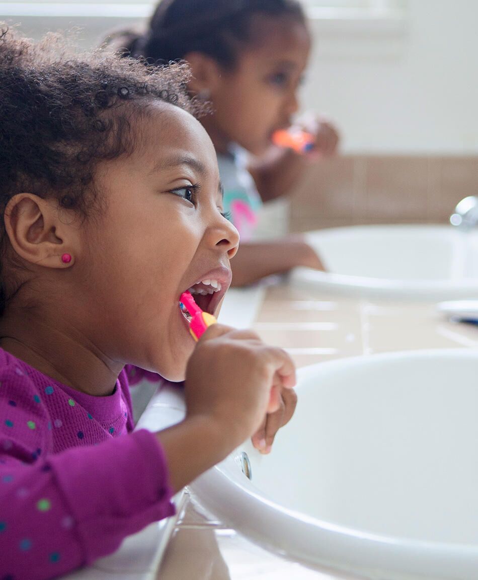 Baby deals tooth brushing