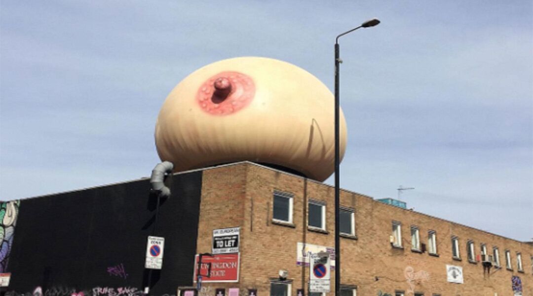giant inflatable boob on top of building