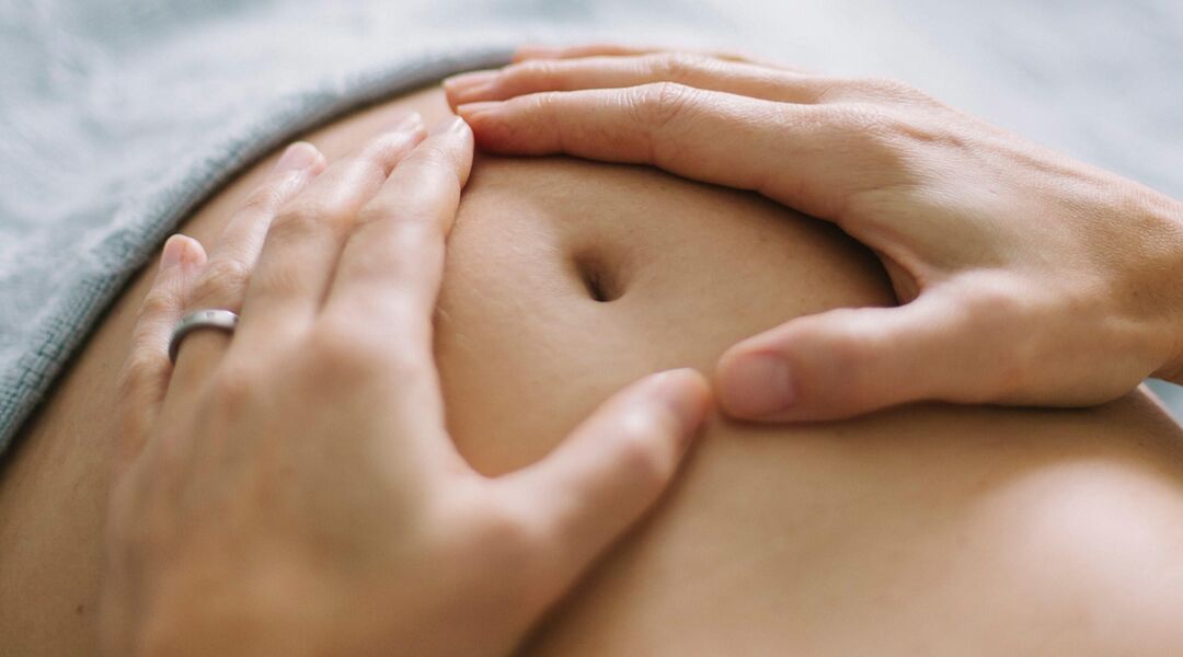 pregnant woman hands belly