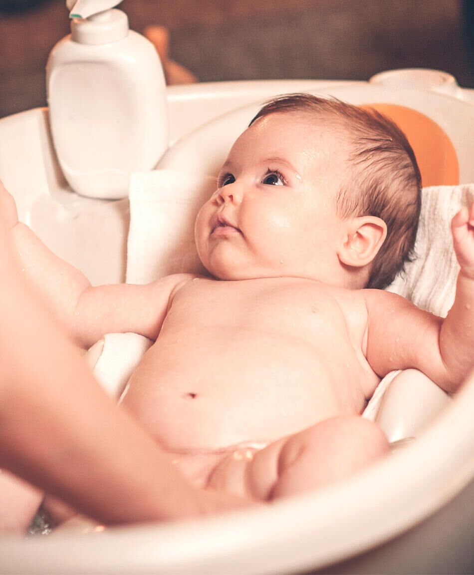 How to give a newborn deals a bath in a tub