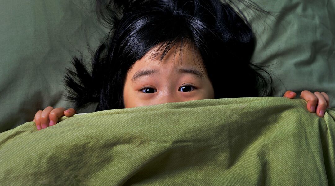 Girl in bed having night terrors