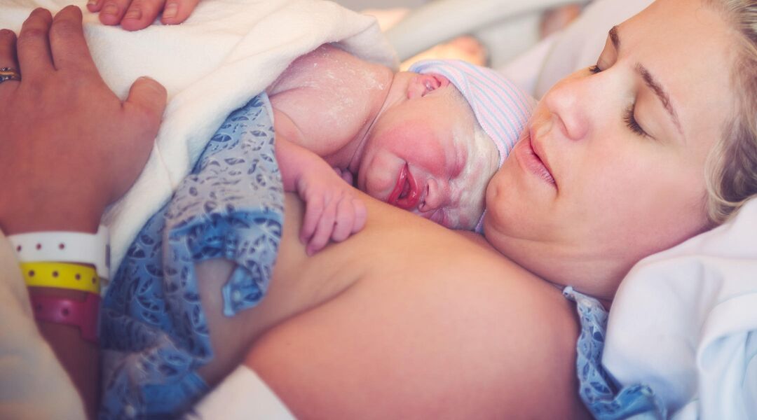 gentle c-section providing skin to skin contact between mom and newborn