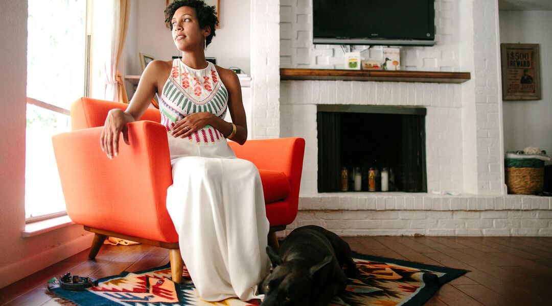 pregnant woman waiting sitting looking out window