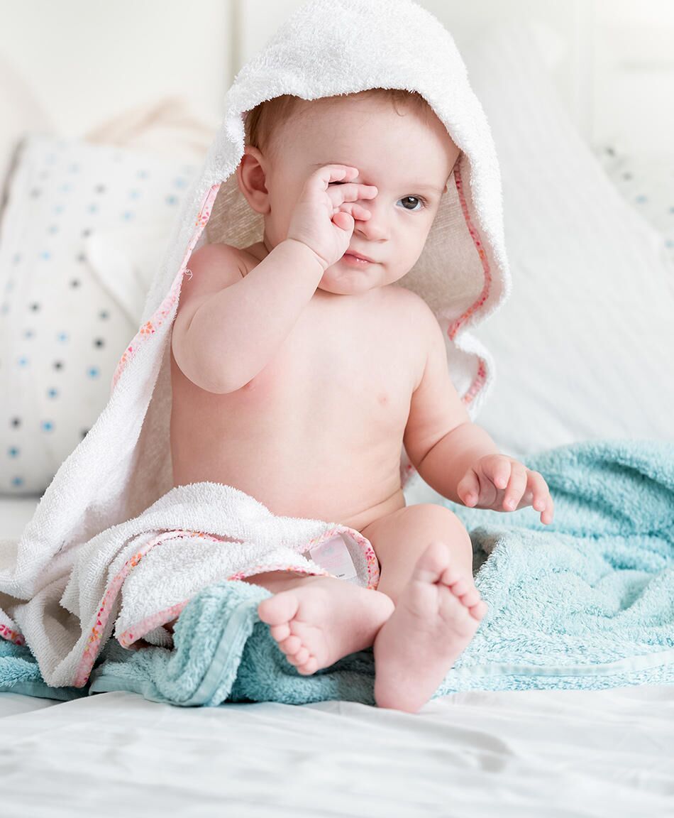 Tiny Newborn Twins Boys In White Cocoons On A White Background A