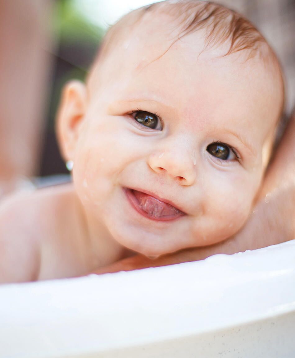 giving newborn first bath