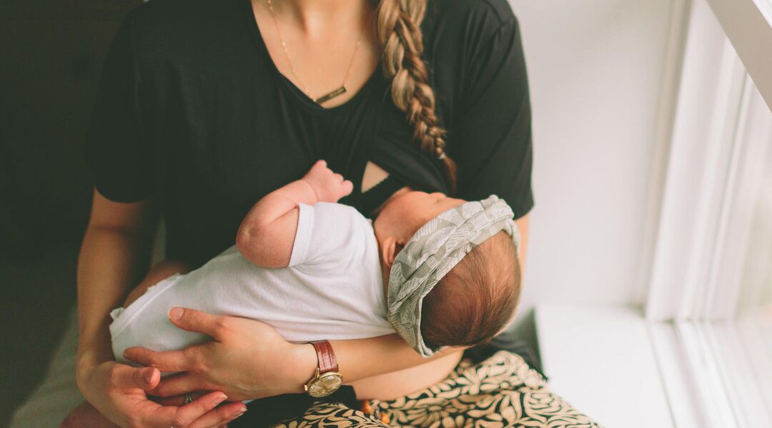 new mother breastfeeding baby