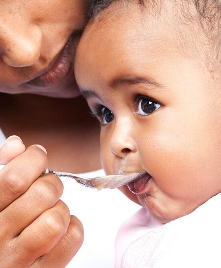 Cute Baby Hand Reaching For Spoon Baby Food Concept Stock Photo - Download  Image Now - iStock