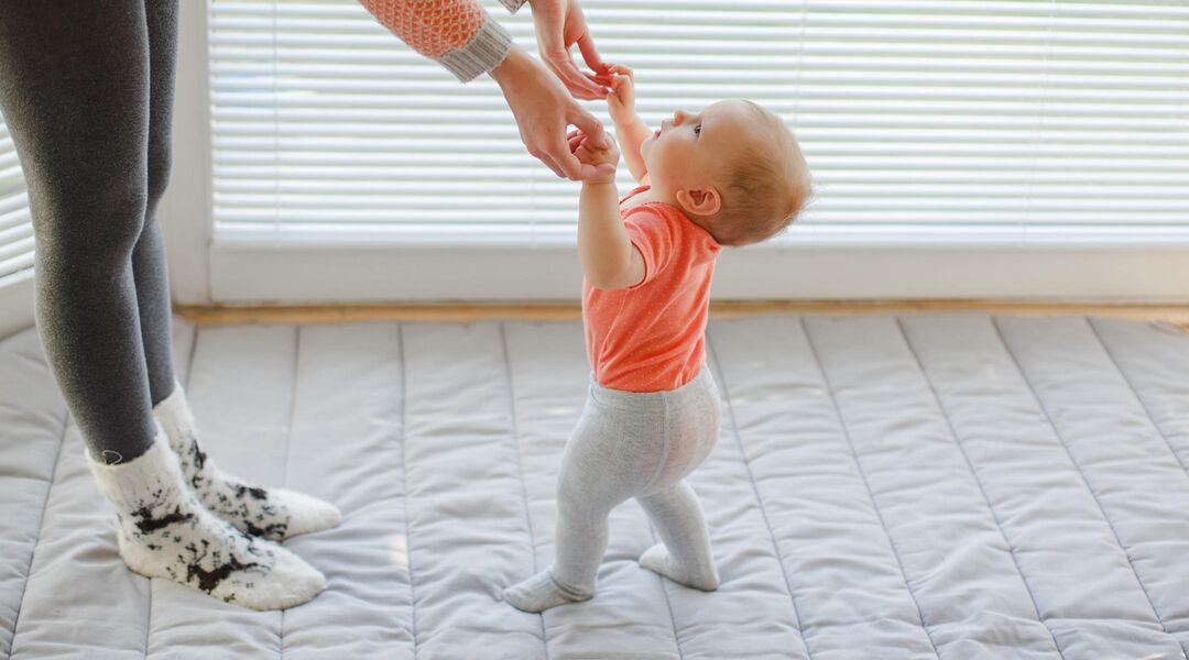 encourage baby to stand